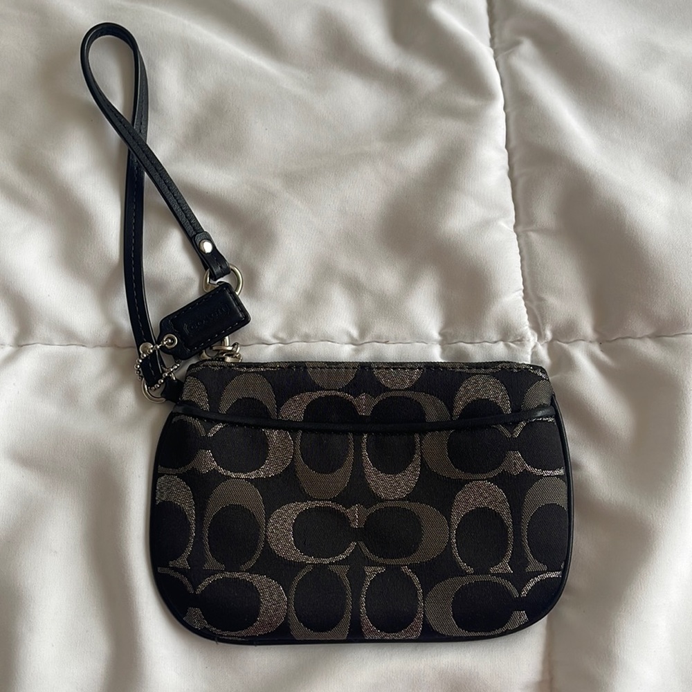 Black and silver Coach Wristlet